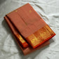 Mandara Peach – Pure Korvai Kanchipuram Silk Saree
Soft peach shot body with dainty gold chakram buttas
Vermilion-orange korvai borders with peacock medallions
Grand kumkumam red pallu with full zari brocade & temple panels
Silk Mark Certified | Free Ship