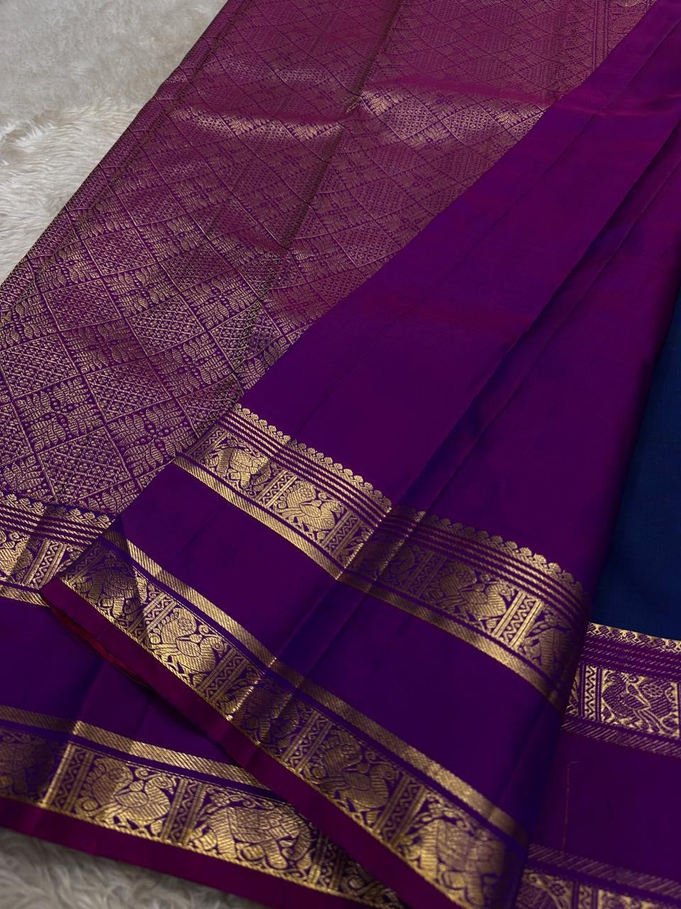 Purple zari woven pallu close-up with lattice weave, temple peaks and heritage border