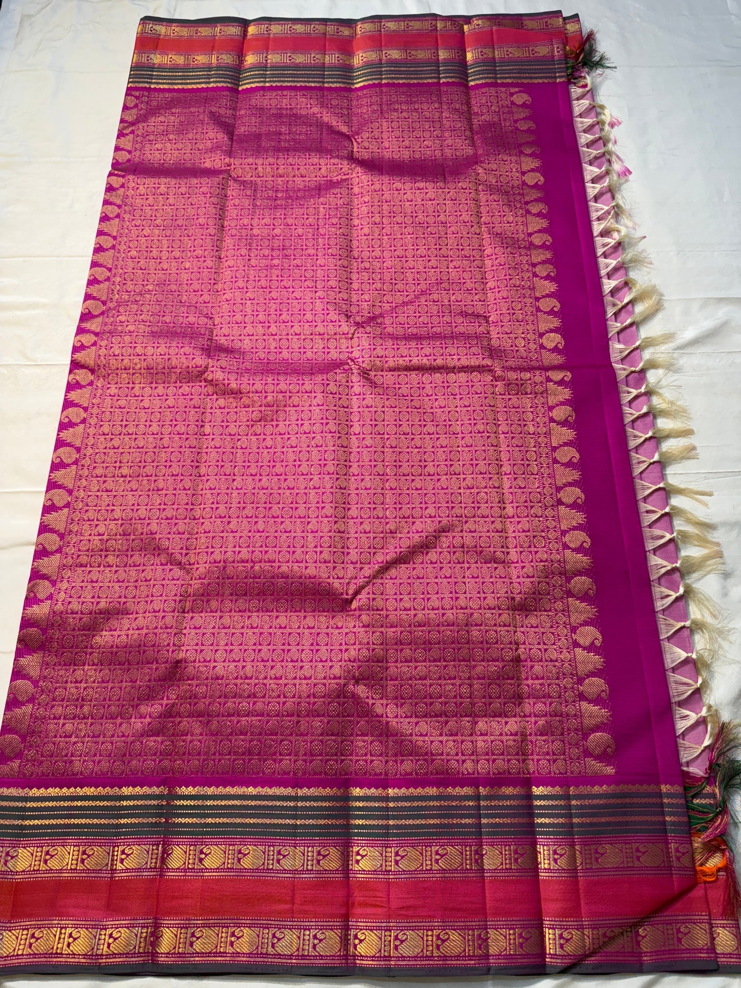 Pink Ombre Kanchipuram Pure Silk

Fuchsia Korvai Border • Charcoal stripes

Gold Zari Buttas (chakram & mango)

Rich zAri Pallu • Blouse included

Silk Mark Certified • Free USA Shipping • Ships in Two Weeks

— Pink Ombre Butta Korvai