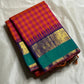 Chemman Maragatha Kattam
Pure Kanchipuram Silk Saree – Reddish-Orange & Maragatha Green Micro Checks
Deep violet korvai borders with gold zari floral motifs
Grand zari pallu with classic brocade detailing
Silk mark certified, ships in 2 weeks