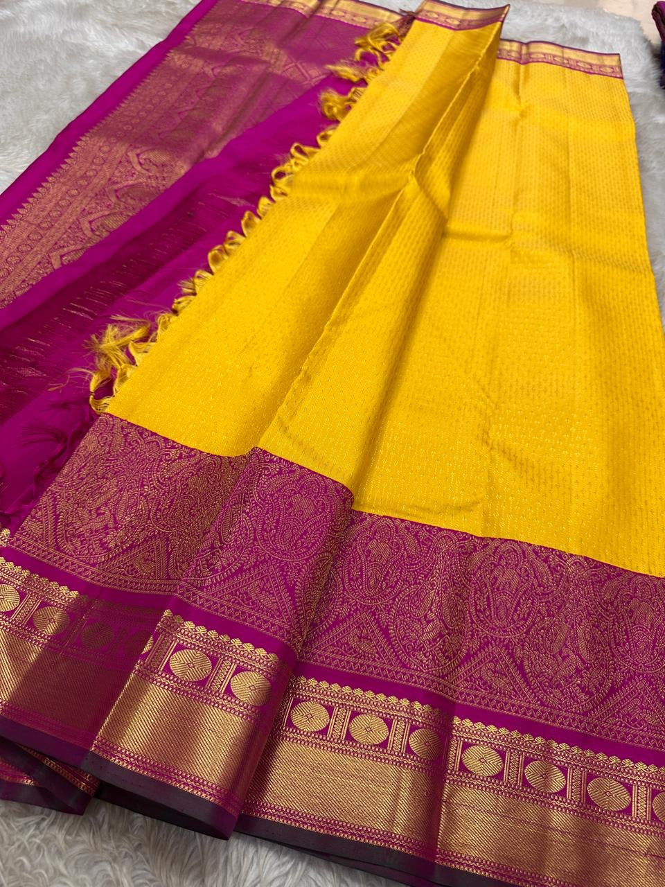 Manjula – Vibrant Yellow Pure Silk Kanchipuram Saree with Handwoven Magenta Benares-Style Dual Border, Maanthulir Green Selvedge, and Intricate Paisley, Rudhraksham & Floral Motifs on Pallu