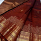 Gilded Rust – Pure Kanchipuram Silk Saree
Deep rust body with delicate paisley zari buttas 🌿
Antique-gold border featuring kaddi stripes & floral motifs ✨
Grand brocade pallu with lattice jaal & floral vines 🕊️

Silk Mark Certified, delivery in 2 weeks