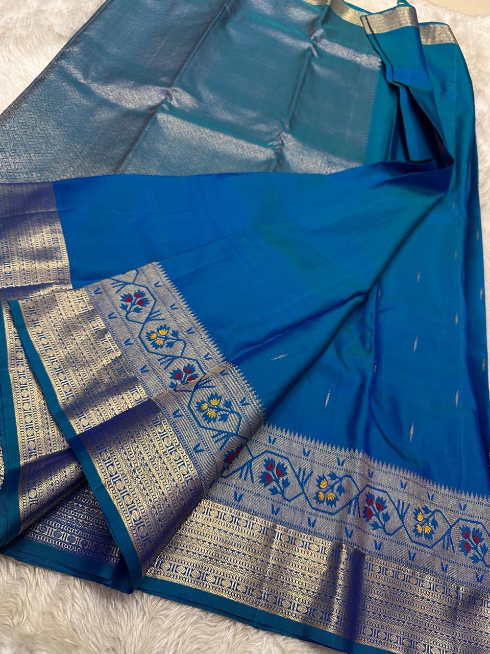 Vibha  peacock blue green shot double color Pure Kanchipuram Silk Saree Blending the Grandeur of South Indian Weaving with Paithani-Inspired Floral Zari Borders and a Lustrous Rose Gold zari Pallu