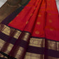 Vivid red  shot deep pink with coffee brown Mayil Kamalam rettapettu border and butta paisley Zari woven butta on body pure silk Kanchipuram saree