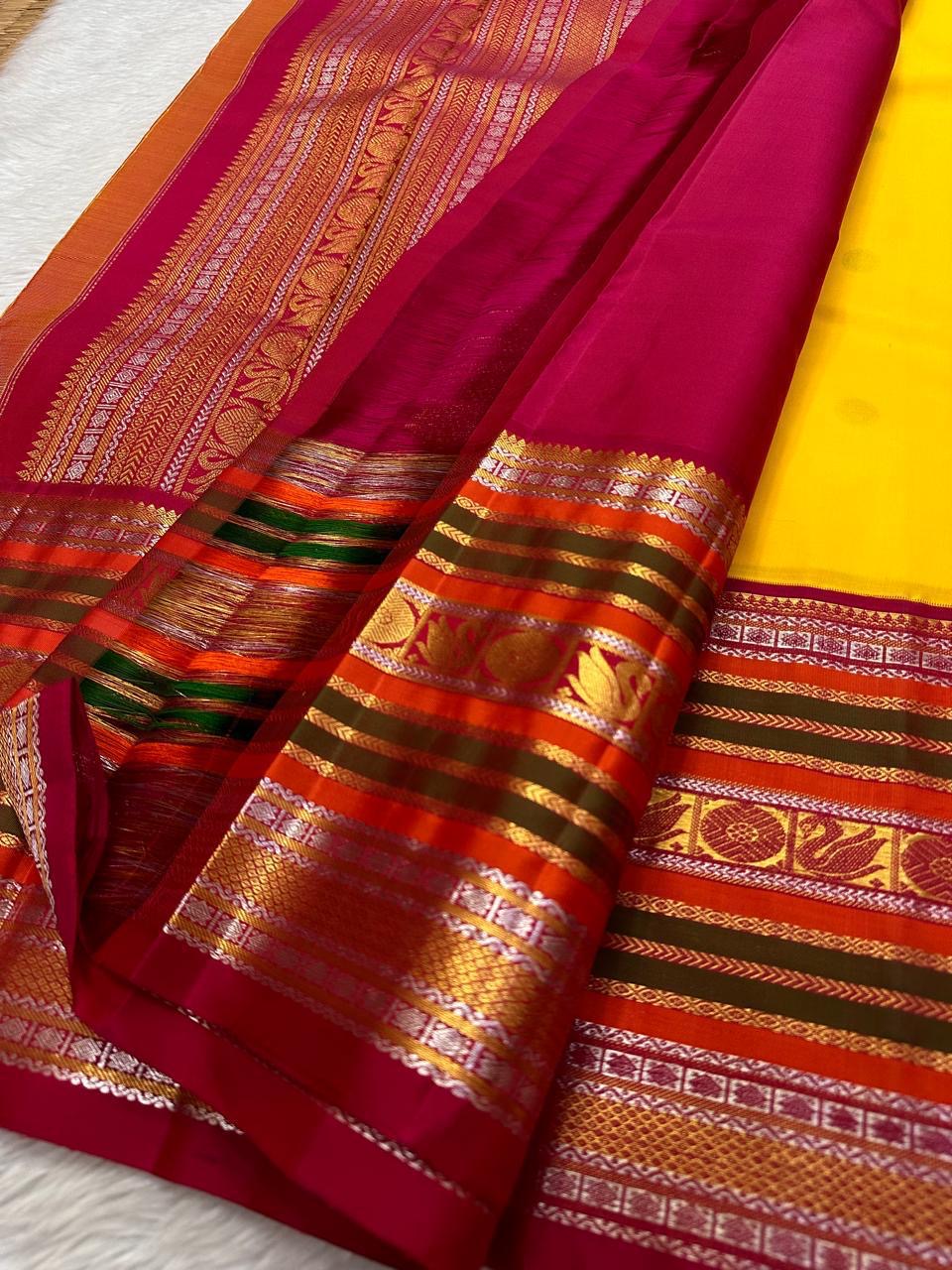 Bhavya – Mustard & Maroon Kanchipuram Pure Silk Saree
Featuring Lotus & hamsa  Motifs in Luxurious Sonaroopa Zari
A Timeless Elegance Woven for Celebrations and Special Moments