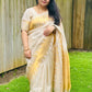 Ivory Glow ✨ – Soft Banarasi Silk Saree
Elegant Ivory Body with Lustrous Sheen
Gold Zari Lightning Border for Festive Radiance
Onam Special Edition – Traditional & Timeless
Silk Mark Certified | Free USA Shipping | Ready to Ship