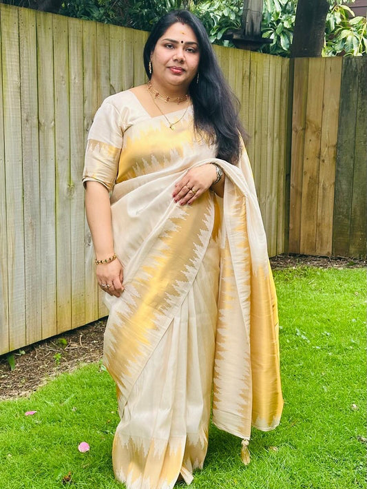 Ivory Glow ✨ – Soft Banarasi Silk Saree
Elegant Ivory Body with Lustrous Sheen
Gold Zari Lightning Border for Festive Radiance
Onam Special Edition – Traditional & Timeless
Silk Mark Certified | Free USA Shipping | Ready to Ship