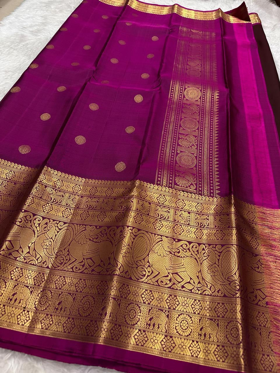 Espresso brown Pure Silk Kanjivaram Butta saree with grand Yazhi zari border and rani pink contrast