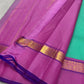 Jade Blossom – Pure Silk Kanchipuram Saree
Elegant Jade-Teal Body with Lustrous Weave 🌿
Rani-Magenta Contrast Border with Gold Zari ✨ purple selvedge 
Grand Magenta Pallu in Lattice Design
Silk Mark Certified | ships in 2 weeks