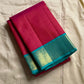 Leela Kattam — Kanchipuram Pure Silk

Rani-pink micro kattam body with soft vaira-oosi sheen

Contrast teal korvai borders with gold lattice & coin roundels

Rich teal pallu with all-over diamond/leaf zari jaal; rani tassels

Silk Mark Certified •