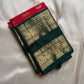 Sindoor red Kanchipuram silk saree folded with elephant zari woven green border