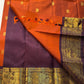 Rust Orange & Wine Korvai – Pure Kanchipuram Silk Saree
Burnt rust-orange shot body with dainty gold paisley buttas
Deep wine korvai borders in antique gold—Annapakshi & Yaali medallions
Grand wine pallu with full-zari jaal & temple panels
Silk Mark