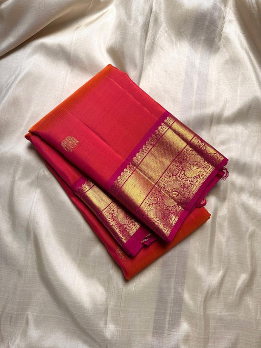 Sunset Symphony lux cascade of silk in vibrant orange and pink shot double shade pure silk Kanchipuram with peacock bavanji border and elephant and peacock butta