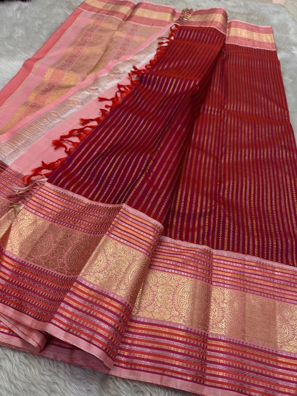 Red and pink pure silk Kanchipuram with the en vogue gold and silver zari border and Pallu