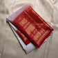 A true festival essential white with dashing red pure silk Kanchipuram saree with a kamalam and mayil detailed border zari work , red reku and Pallu