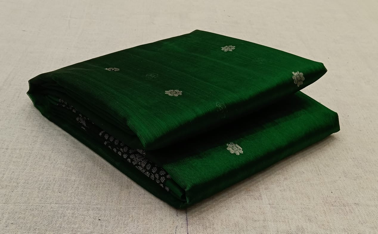 folded green chanderi silk saree with small woven motifs visible
