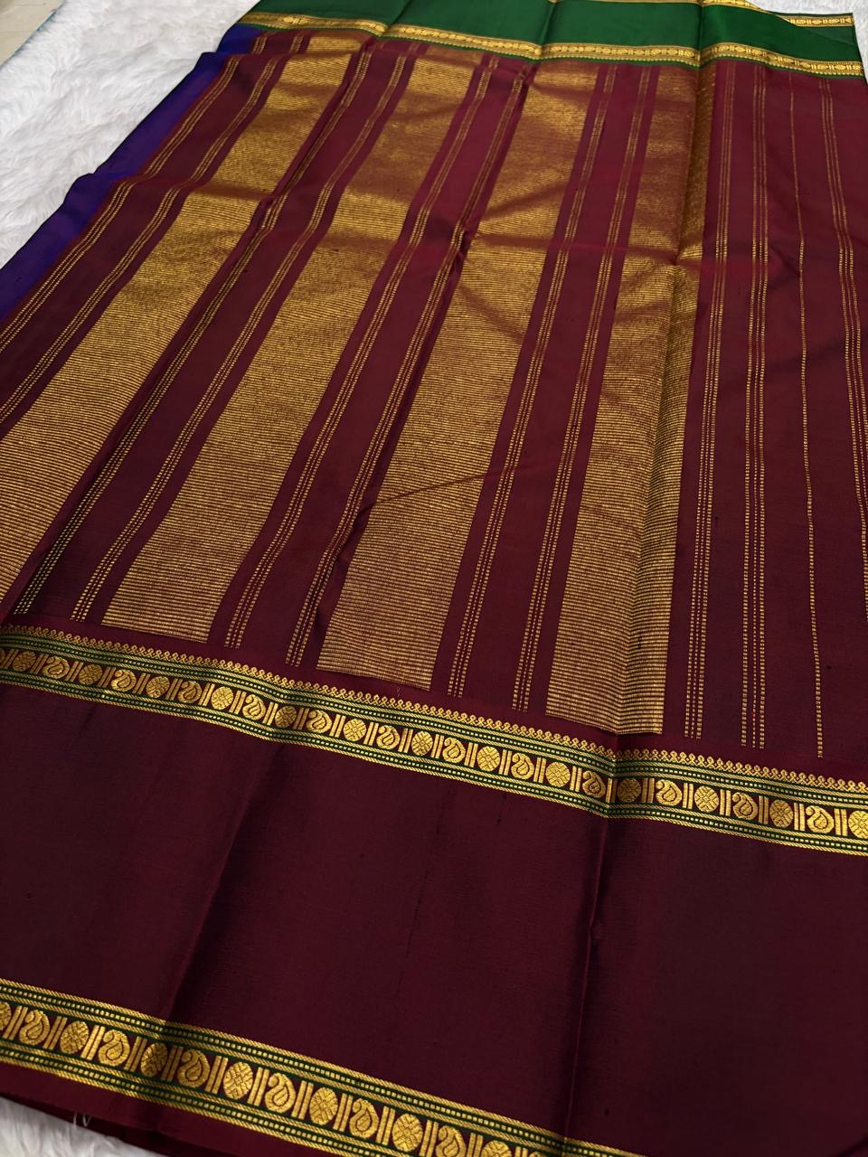 Red Kancheepuram silk saree with grid zari pattern and blue contrast border