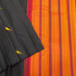 Black Pure Kanchipuram Silk Saree with scattered yellow and red bird motifs laid beside an orange striped pallu with pink border.