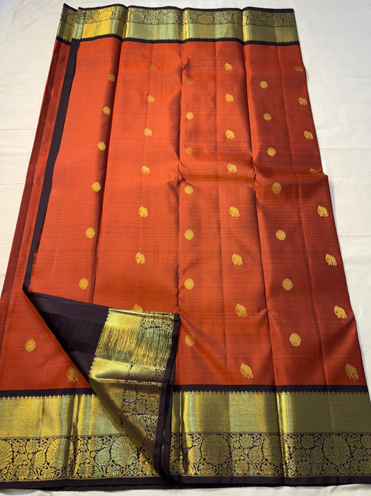Rust orange Terracotta, Yanai Butta
 — Coffee Brown Korvai Kanchipuram
Deep coffee-brown korvai borders with wide antique-gold kaddi & floral vines
Silk Mark Certified | Free Shipping within USA | Ships in Two Weeks
Blouse Stitching available $30