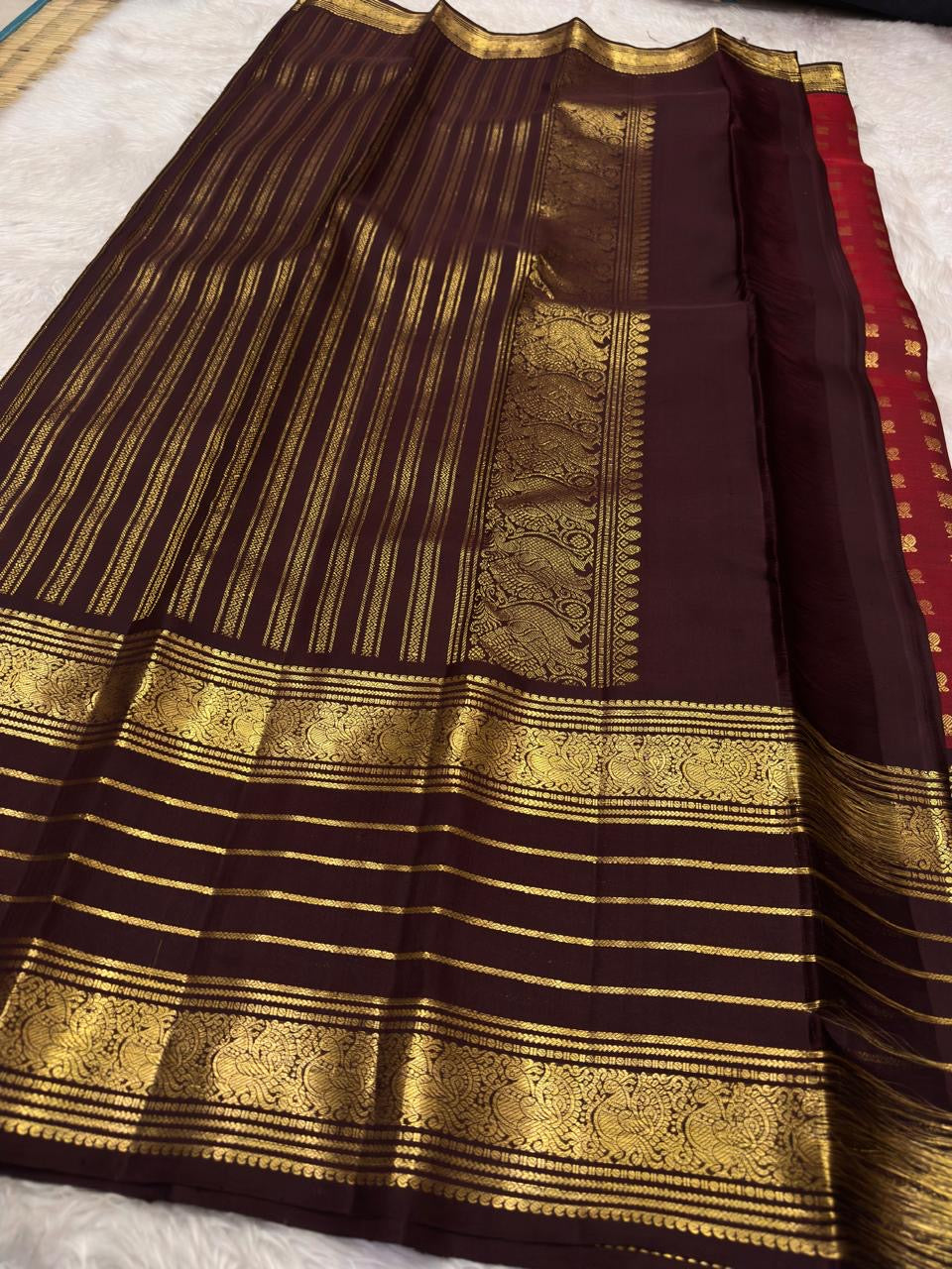 Traditional Kanchipuram Varisaipet saree in garnet wine red with heritage antique gold zari craftsmanship