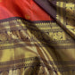 Aruna Mayil – Pure Korvai Kanchipuram Silk Saree

Brick red body with zari rosette buttas

Grand coffee-brown korvai border & pallu with peacock panels, medallions & temple teeth in rich gold zari

Silk Mark Certified | Blouse Piece Included | Fall & Pico