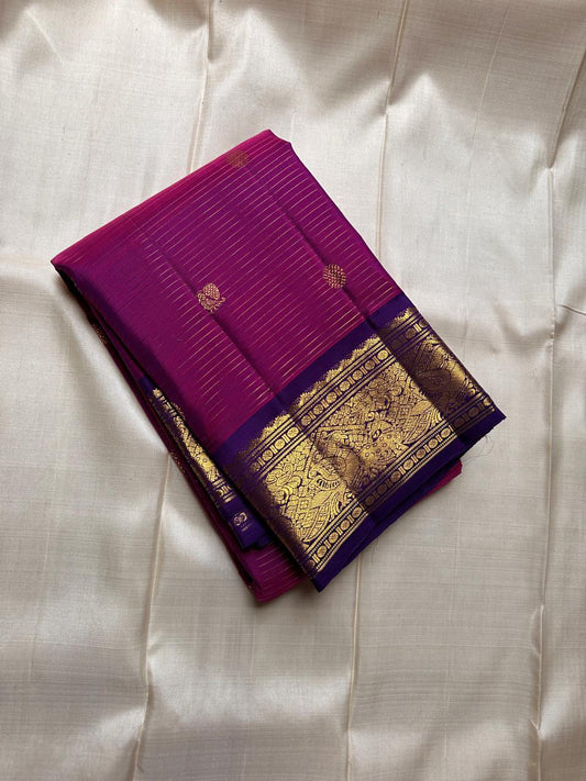 Vairaoosi deep pink with zari lines all over and a deep purple border with Rudhraksha pettu vanasringaram and chakram butta Pallu