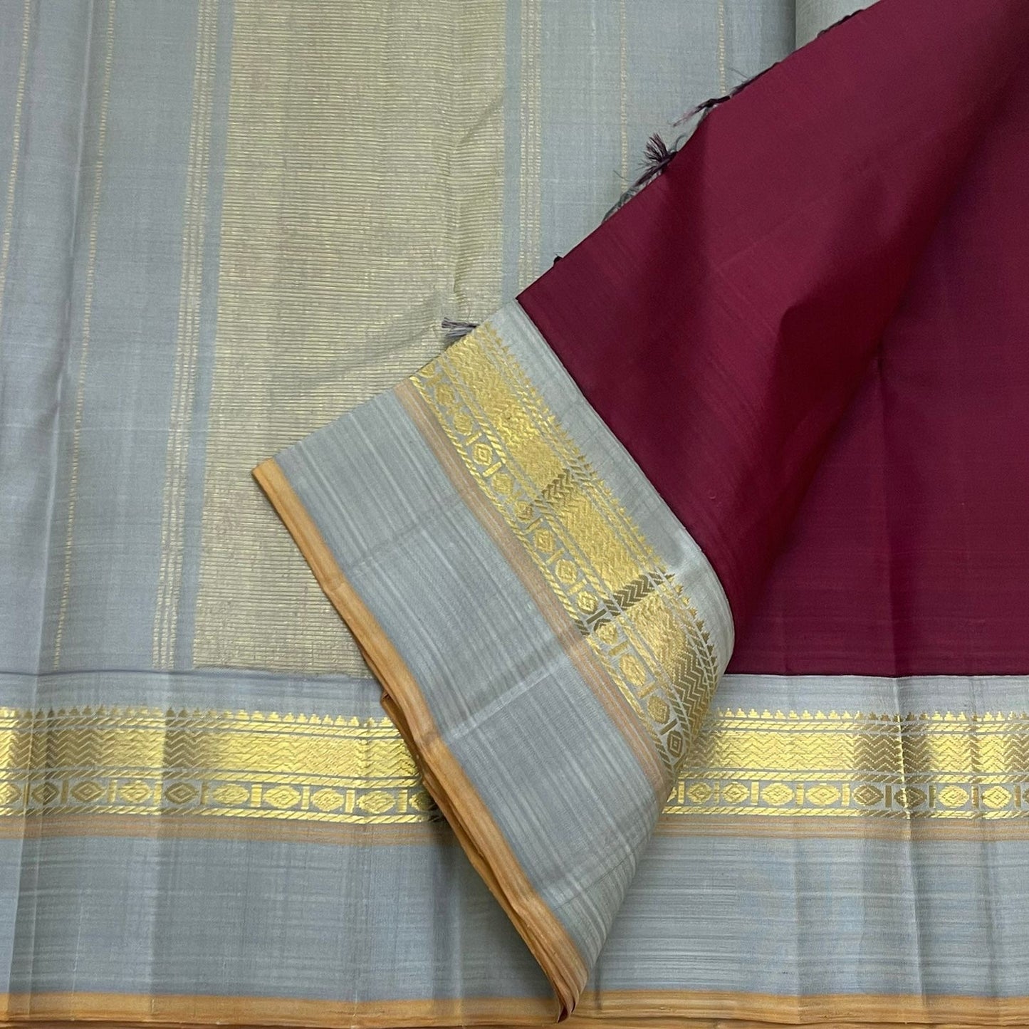 Deep Ruby Dove Grey – Pure Silk Kanchipuram Saree
Korvai Weave with Elegant Contrast Borders
Golden Zari detailed Pallu
Silk Mark Certified | Fall & Pico Done | Blouse Stitching Available ($30)