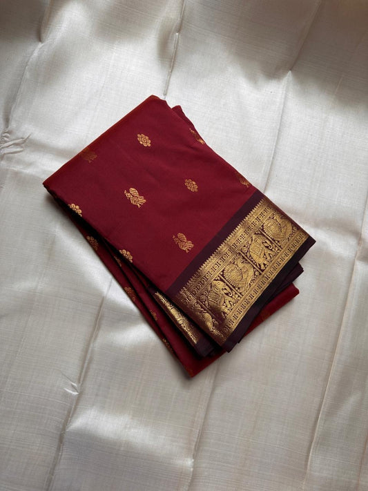 Maroon Yali Butta – Pure Korvai Kanchipuram Silk Saree
Deep maroon body with delicate gold zari paisley & floral buttas
Contrast chocolate-maroon korvai border featuring bold yali motifs
Silk mark certified- ships in 2 weeks