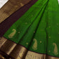 Shringaram – Green — Pure Silk Kanchipuram

Emerald-green body with coin buttas & grand mango (mankolam) motifs

Deep coffee-brown korvai borders with peacock panel zari

Rich coffee-brown brocade pallu with circular & diamond jaal

Silk mark