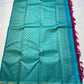 Leela Kattam — Kanchipuram Pure Silk

Rani-pink micro kattam body with soft vaira-oosi sheen

Contrast teal korvai borders with gold lattice & coin roundels

Rich teal pallu with all-over diamond/leaf zari jaal; rani tassels

Silk Mark Certified •