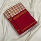 Folded cream and red checked silk saree with a deep red border and thin gold zari woven lines on white fabric.