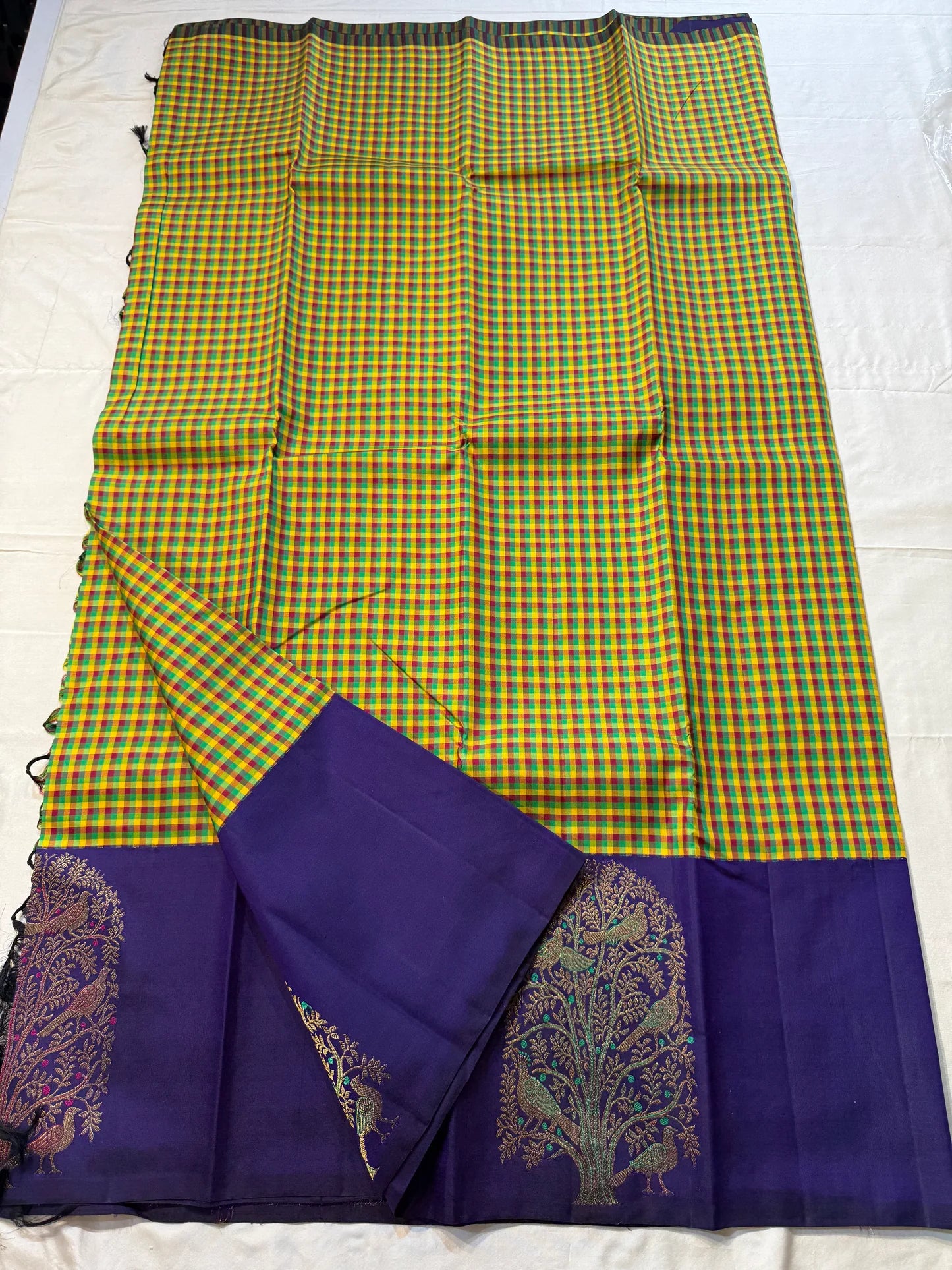 Vriksham ✨
Pure Kanchipuram Silk Saree in Multicolor Checks & Purple
kattam body in yellow, green, red & Rama blue
Royal purple border with zari Tree-of-Life & birds

Silk Mark Certified, delivery in 2 weeks