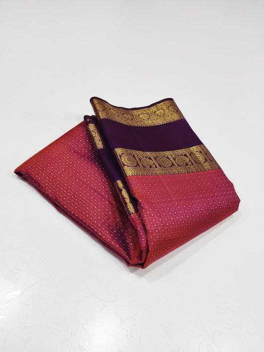 Crimson Amethyst – Pure Kanchipuram Silk Saree
Radiant crimson red body woven with delicate gold kattam checks at Iran buttas ✨
Paired with rich amethyst purple korvai borders in ornate zari
Grand brocade pallu Silk Mark Certified, delivery in 2 weeks