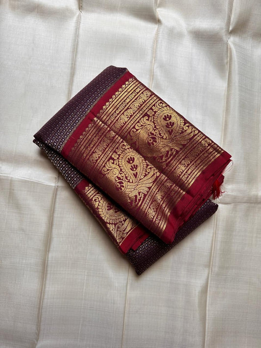 Pure silk kanchipuram deep coffee with zari motifs and bright red border