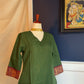 Vanappu — Green & Red Sungudi Zari Kattam Kurti Set
Forest-Green Handspun Cotton with Ruby-Red Zari Mayil Borders & Kattam Checks ✨
Handwoven in Madurai • Fully Lined • Free USA Shipping • Ready to Ship ✅