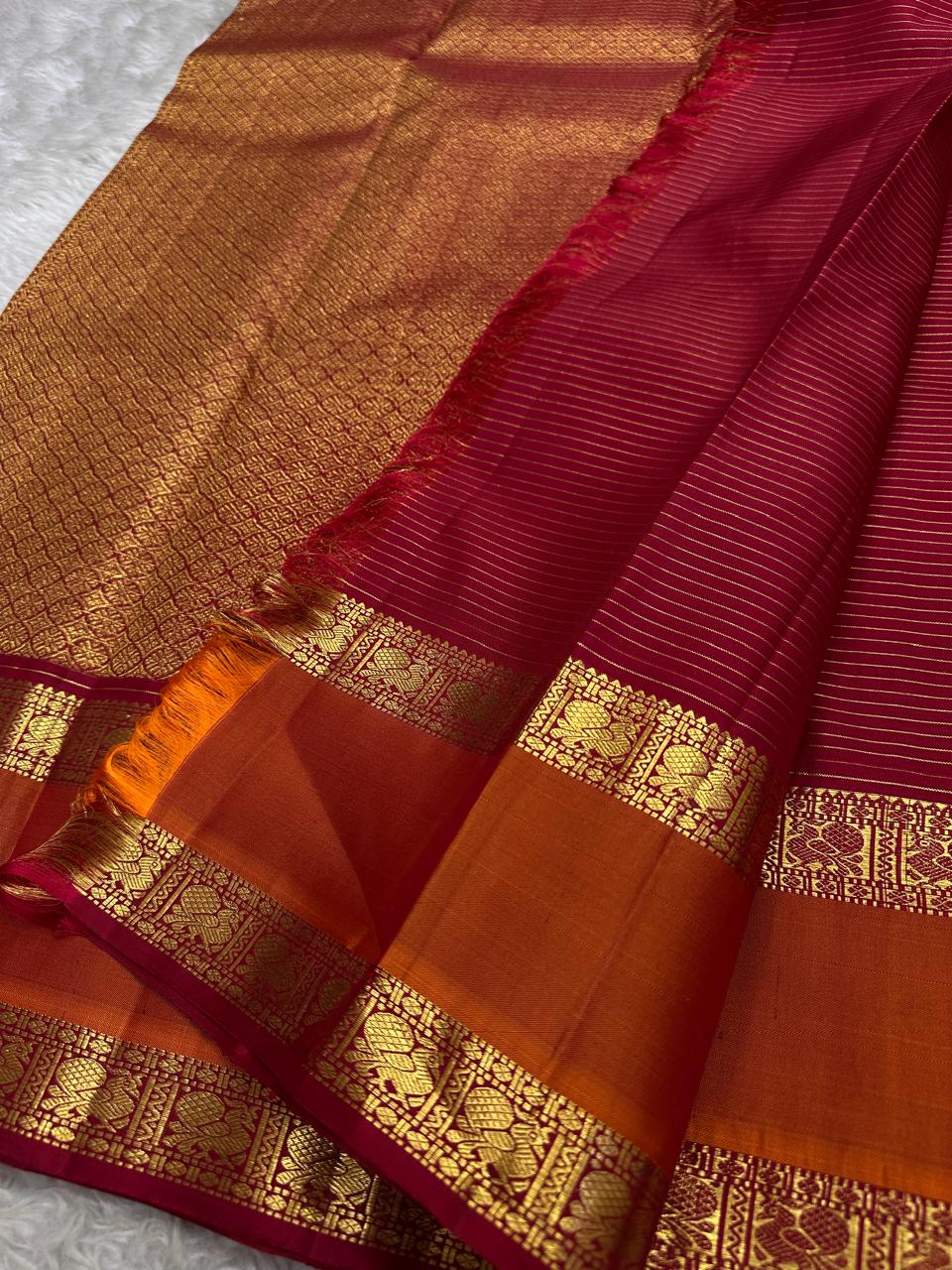 Brick Red Saffron Zari Kattam | Pure Kanchipuram Silk ✨
Brick-red body with zari kattam checks, gold buttas & saffron-orange border ❤️
Silk Mark Certified • Free Shipping within USA • Ships in Two Weeks ✅