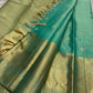 Minted Teal Glow Vaira-oosi

Pastel Teal Body with Silver “Chakram” Buttas

Antique-Gold Zari Paisley Border & Rich Woven Pallu

Silk Mark Certified ✅ Free Shipping within USA ✅

Ships in Two Weeks ✅ Blouse Stitching Available ✅