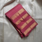 vasantham  pink – Handwoven Kanchipuram Silk Saree
A poem in pink silk. The body glows in a serene rose pink, softly accented by delicate gold vertical lines and dainty gold zari buttas that glint like little blessings.