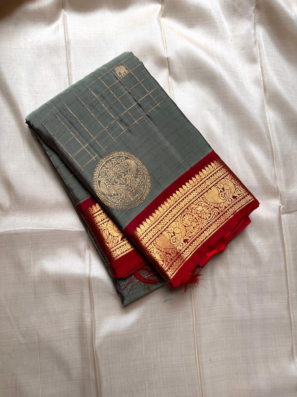 Sorgavaasal Kili , stunning motif in  golden dove grey and red zari kattam zari woven yazhi buttas in pure silk kanchipuram