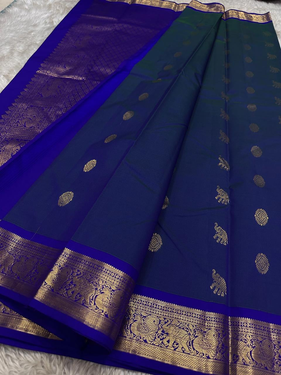 Neelam Light Weight – Budget Kanchipuram Silk Saree
Peacock-blue body with gold zari gaja & medallion buttas
Royal blue border with peacock & floral zari detailing
Ships in two weeks
Silk Mark Certified | Fall & Pico Done