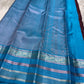 Most unique brown and blue combination in pure silk Kanchipuram with Zari kattam and elephant motif border