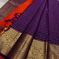 Aubergine Amber Kattam – Pure Kanchipuram Silk Saree
Deep Aubergine Purple Body with Gold Kattam Checks
Grand Zari Borders with Majestic Peacock Motifs
Contrast Amber-Orange Pallu with Rich Zari Detailing
Silk Mark Certified | ships in two weeks