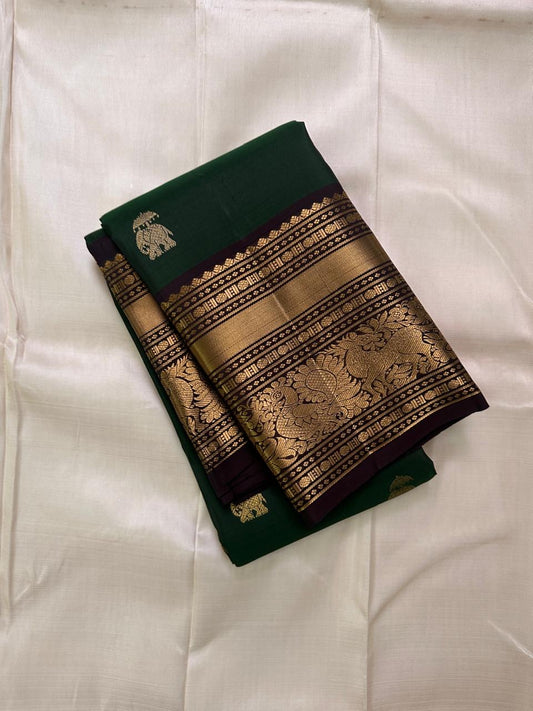 Emerald Green Elephant Butta — Pure Kanchipuram Silk Saree
Emerald green body with antique-gold zari elephant buttas and grand coffee-brown korvai borders featuring yali–mayil motifs.
Silk Mark Certified • Blouse Stitching Available ($30) • Free Shipping