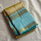 Body: pastel lemon-cream with tiny gold zari buttas

Borders/Pallu: sea-foam aqua with temple (reku) peaks & paisley vine zari

Silk Mark Certified • Free USA Shipping • Ships in Two Weeks