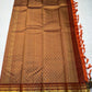 TEJAS – Vibrant Rust Orange Podi Kattam Kanchipuram Silk Saree

Micro-checks body with scattered gold chakram buttas; rich contrast maroon korvai borders

Grand circular annapakshi medallions in lustrous zari; ornate-jaal pallu & tassels

Silk Mark