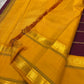 Close-up of mustard pallu on pure Kanchipuram silk saree with gold zari geometric motifs and silk texture, available in the USA.