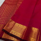 Charita – Tomato Red Kanchipuram Silk Saree
With Bold Zari Kattam Checks & Floral Motifs
Featuring Arai Maadam Border & Rettapet border