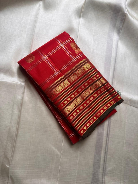 Vermilion Varisaipet – Pure Kanchipuram Silk Saree
Deep Vermilion Red Body with Golden Zari Checks & Buttas
Grand Varisaipet Border with Temple & Floral Motifs
Radiant Red-Orange Pallu Adorned with Lustrous Zari

Silk Mark Certified, delivery in 2 weeks