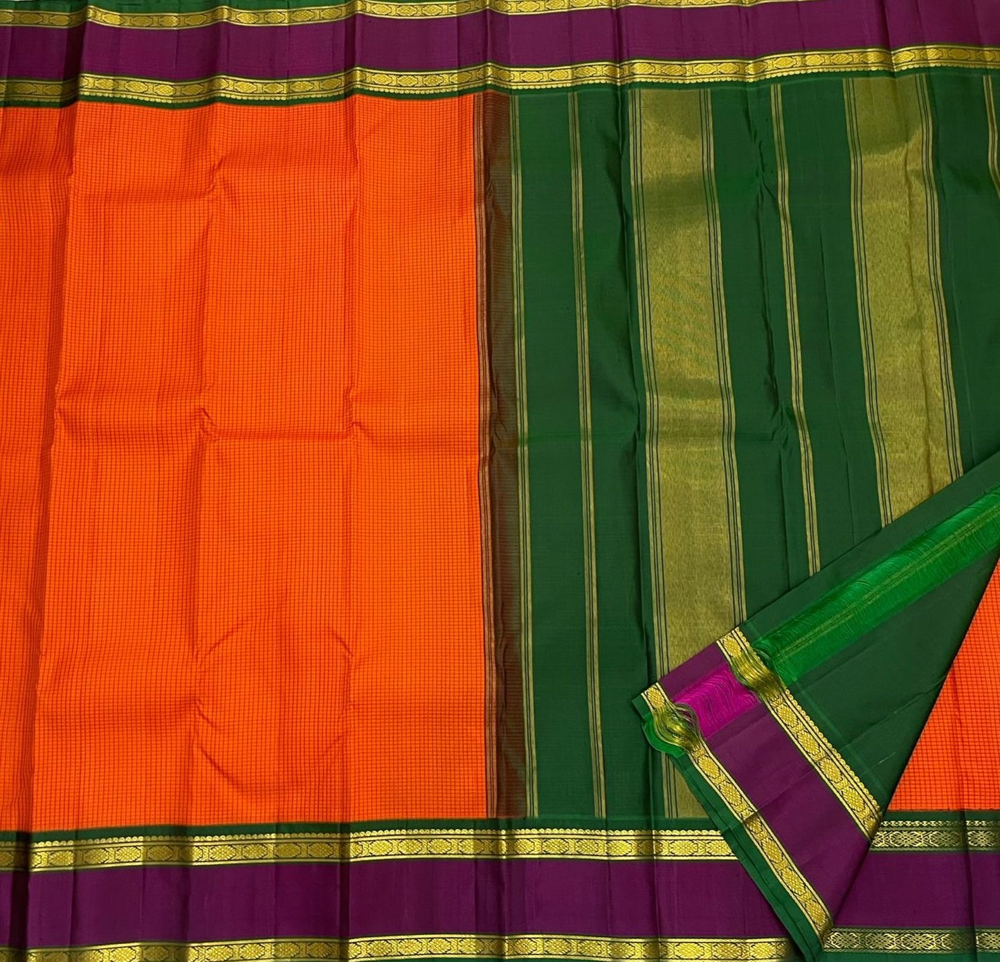 Sunset Kattam — Pure Kanchipuram Silk Saree
Sunset-orange kattam body with royal purple borders and emerald green pallu in fine zari.
Silk Mark Certified • Free Shipping within USA • Ships in Two Weeks