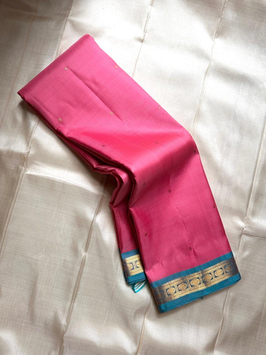 Varnam – Pastel Pink Kanchipuram Silk Saree with Sky Blue Rudraksha Border & Grid Zari Pallu | Baby Kamalam Buttas | Pure Handloom Elegance